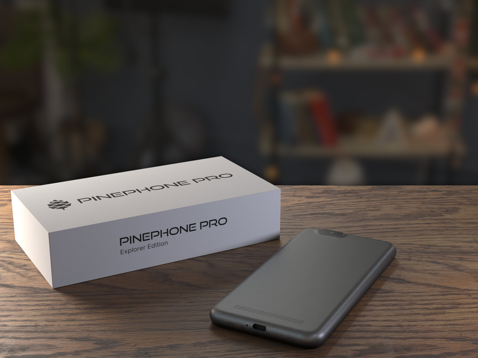 A PinePhone Pro sitting next to its box.